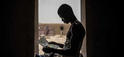 men from Gambia in front of a window 