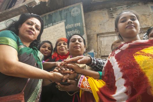 Shamima Nasreen (43, on left) and some of her co-workers. Shamima Nasreen is founder of SBGSKF, an organisation that lobbies for better and fairer working conditions in garment factories in Bangladesh. Credit: Saikat Mojumder/Oxfam