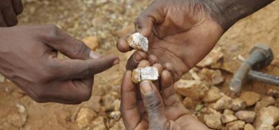 Families are increasingly resorting to trying to make a small income from the gold fields. Artisanal Gold-mining is labour intensive, using only very basic tools. The daily haul may just buy a dish of millet. Photo: Andy Hall/Oxfam 