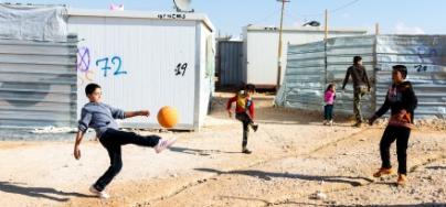 Syrian children play football in Za'atari refugee camp, Lebanon