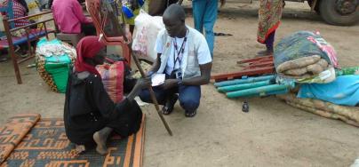 A DRC staff member interviews a woman recently arrived from Khartoum, Sudan. Photo by Gatluak Nen Chan/DRC