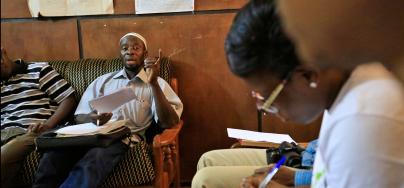 Africa Center for Energy Policy in Ghana interviews a government official regarding a project financed with oil revenues. Credit: George Osodi/Panos for Oxfam America