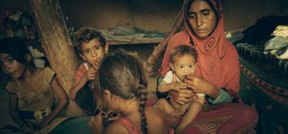 Mona, who fled the frontlines three years ago, can give only bread and tea to her children, the youngest of whom is malnourished. Photo: Sami Jassar/Oxfam in Yemen.