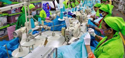 Workers producing personal protective equipment (PPE) for health professionals at a garment factory of Urmi Group in Dhaka on March 31, 2020.© Sk Hasan Ali