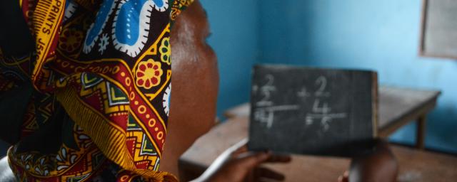 A woman is learning Arithmetic for the first time of her life, during a literacy lesson at the Women’s Home in Bria. Credit: Aurélie Godet, Oxfam 