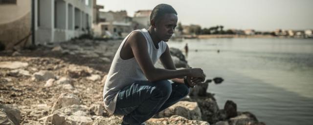 Like Jamal, 23, from Somalia, thousands of refugees and migrants face kidnap, slavery, torture or sexual violence in Libya before crossing the Mediterranean. Photo: Pablo Tosco/Oxfam