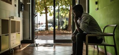 Young man sitting in a chair 