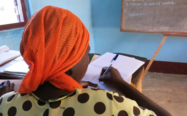 A young woman follows a literacy class at the Women’s Home in Bria, in the heart of the Central African  Republic.