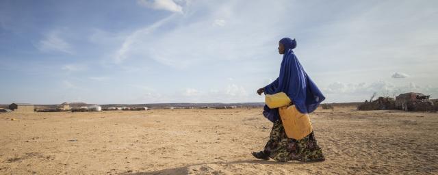 Ayan on her way to fetch water from a water well, in Somaliland.