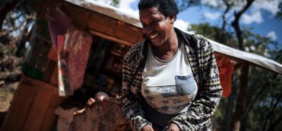 Mauno, 46 stands in front of her shop at Mantapala refugee settlement, Northern Zambia.