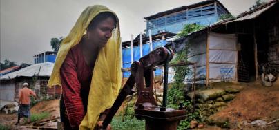 Rohingya refugee Ayesha collecting water for her family in Cox's Bazar, Bangladesh. Credit: Maruf Hasan/Oxfam