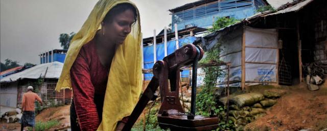 Rohingya refugee Ayesha collecting water for her family in Cox's Bazar, Bangladesh. Credit: Maruf Hasan/Oxfam