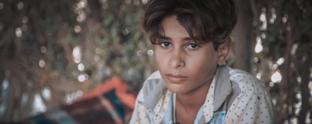 Salah, 11, fled twice during the past four years of war. He witnessed conflict directly and saw people injured and killed. He stopped going to school because he has to work as shepherd or gather plastic to feed his family. Photo: Sami M.Jassar/Oxfam