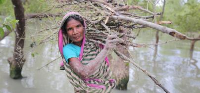 Nurjahan (45) collecting wood to sell for food after cyclone Bulbul. Gabura, Shamnagar. Photo: Fabeha Monir/Oxfam