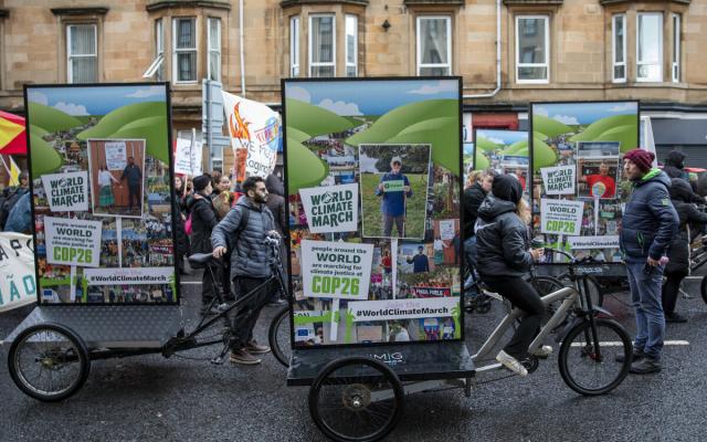 A fleet of Oxfam campaigning adbikes and pedicabs at the COP26 demonstration, part of the global day of action for Climate Justice on November 6, 2021, in Glasgow, Scotland.