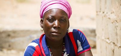 Zoré Fatimata in front of her house, in Burkina Faso. 